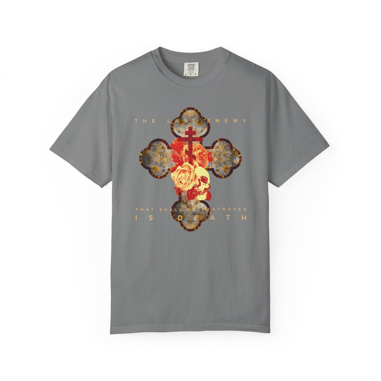 Grey heavyweight unisex tee featuring a metallic gothic cross with rose and skull graphic, and the text “The Final Enemy That Shall Be Destroyed Is Death” (1 Cor 15:26).