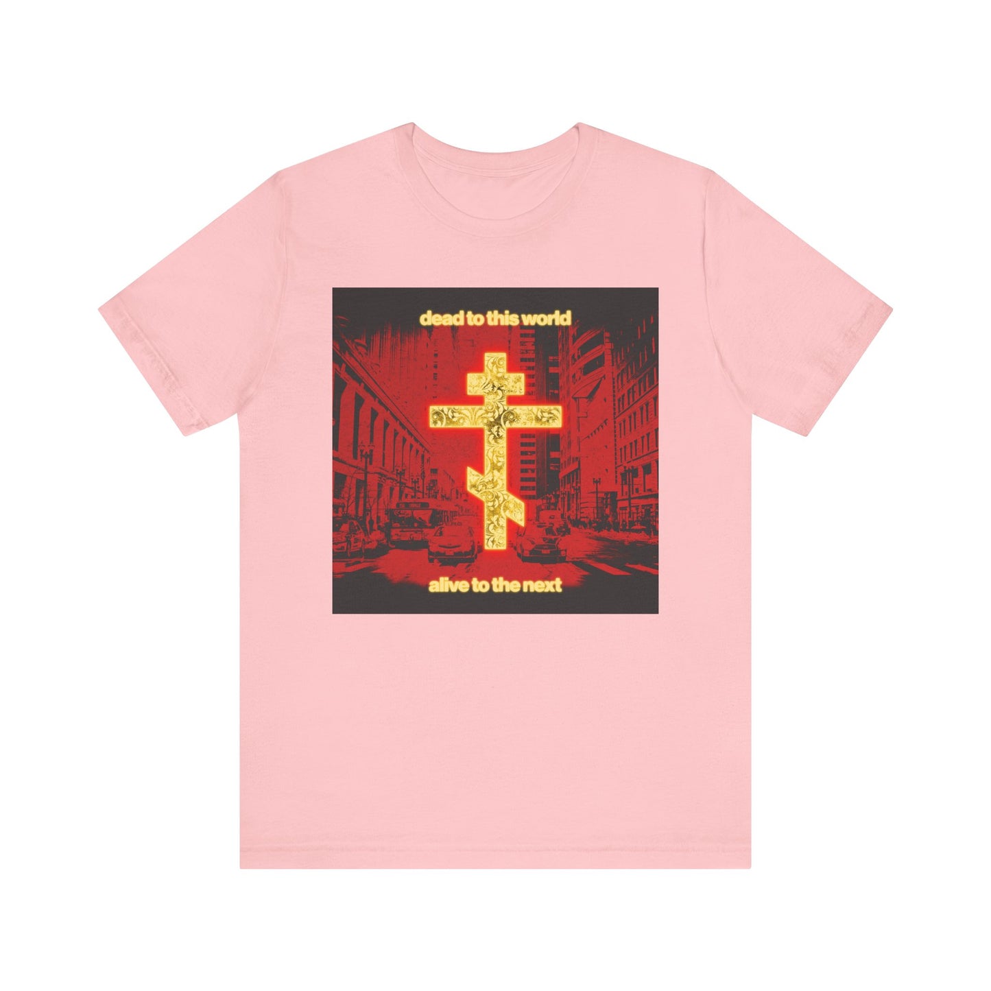 Pink "Dead to This World Alive to the Next" Orthodox Christian unisex tee features a glowing gold cross over a red cityscape, inspired by St Ignatius Brianchaninov’s call to live for eternity. Lightweight cotton.