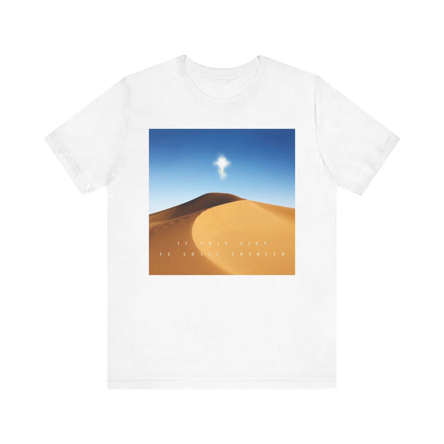 White "In This Sign Ye Shall Conquer Desert Sun Scene" Orthodox Christian tee featuring a sand dune, blue sky, cloud, and inspiring text; lightweight unisex cotton in white.