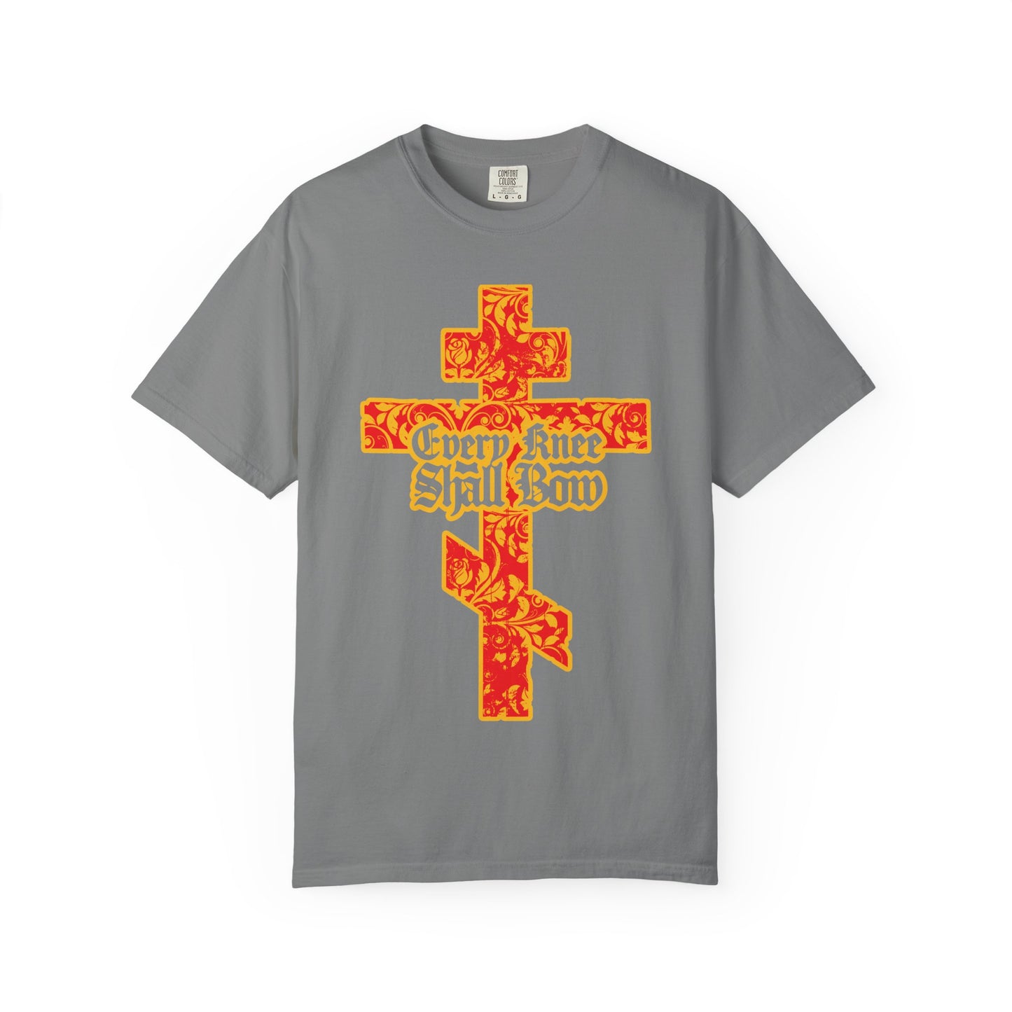 Grey heavyweight cotton unisex tee featuring a gold and red floral textured Orthodox cross with gothic lettering reading “Every Knee Shall Bow” on the front, inspired by Isaiah 45:22-24 and Philippians 2:7-11.