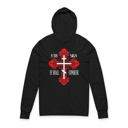 Black hoodie featuring a red ornate Orthodox cross with the phrases "In This Sign Ye Shall Conquer," "ICXC NIKA," and "Jesus Christ Conquers"—a bold Christian hooded shirt expressing faith and victory.