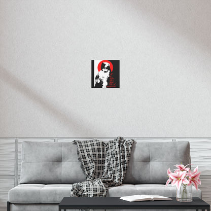 A modern living room with a gray sofa, plaid throw blanket, coffee table with an open "It's Later Than You Think" Orthodox book, pink flowers, and Remembrance of Death black, white, and red Christian art poster on the light-colored wall above the sofa.