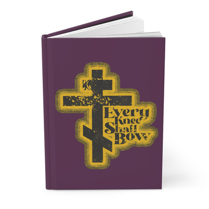 A purple journal titled "Every Knee Shall Bow" with a 70s distressed comic book aesthetic, featuring Philippians 2:10-11 and Isaiah 45:23; an Orthodox Christian blank notebook.