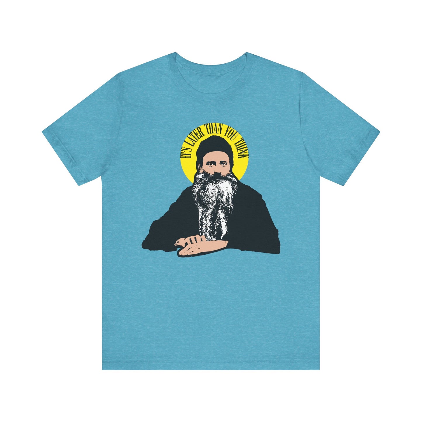 Heather Aqua tee featuring St. Seraphim Rose as a bearded man with a yellow halo and the quote "It’s Later Than You Think." Lightweight cotton, unisex fit, modern American Orthodox saint design.