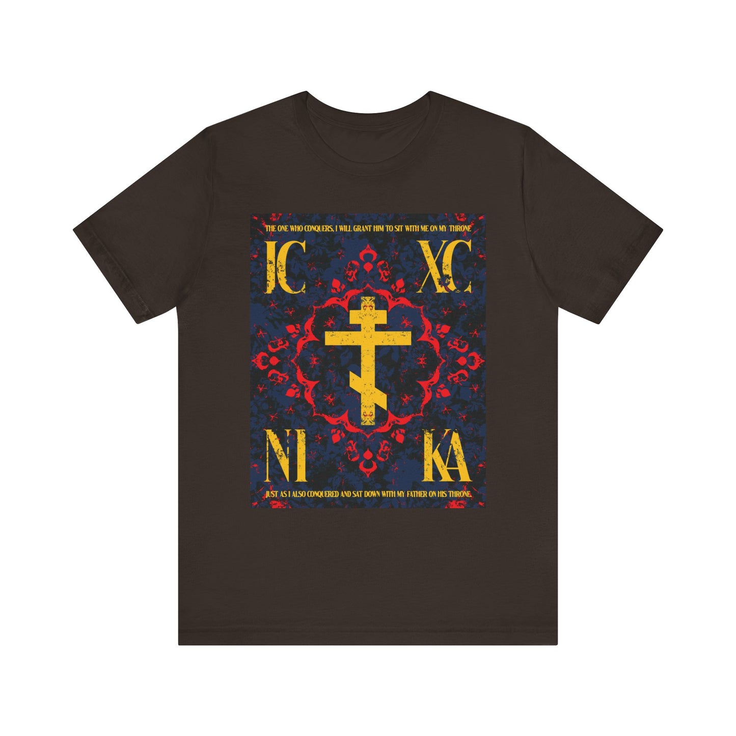 Brown IC XC NIKA Orthodox Cross T-shirt features a medieval floral design with red and blue accents, Cyrillic lettering, and “The One Who Conquers” theme from Revelation 3:21—crafted in lightweight cotton for unisex wear.