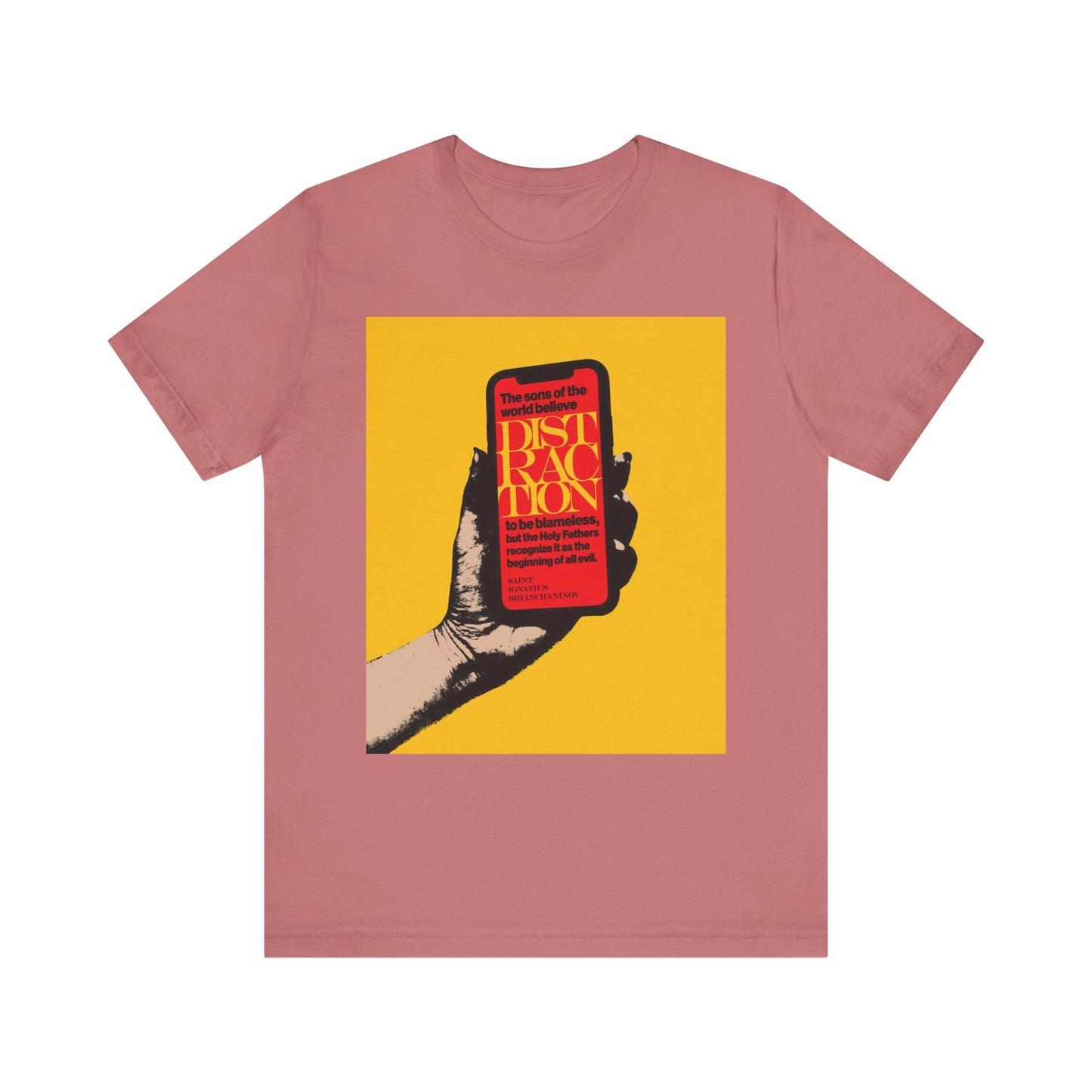 Mauve t-shirt with a graphic of a hand holding a phone against yellow, displaying bold red and yellow text: “Distraction is the Beginning of All Evil”—inspired by St Ignatius Brianchaninov and Orthodox Christian teaching on mobile phone addiction.