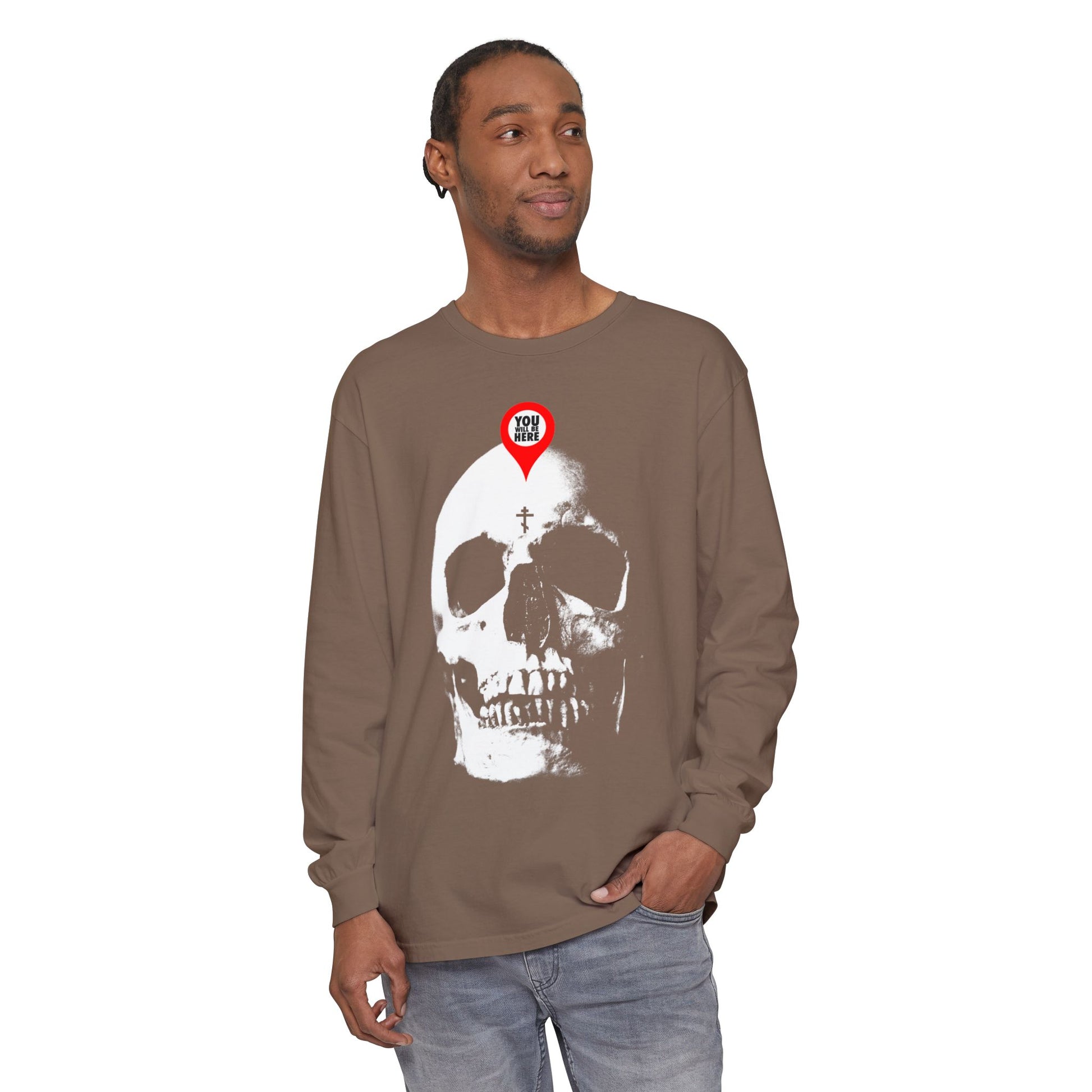 A man in the "You Will Be Here Maps Marker on Skull Design" Orthodox long sleeve, featuring a skull and red pin, reflects St. Ignatius Brianchaninov’s message: “What you are I once was. Remember you will die.” Memento Mori.
