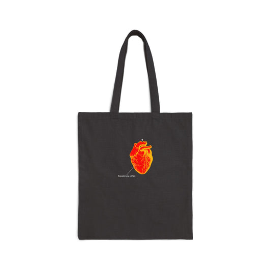Black tote bag featuring an inverted red & orange anatomical heart with "Remember You Will Die" retro medical textbook design, memento mori, Orthodox Christian theme.