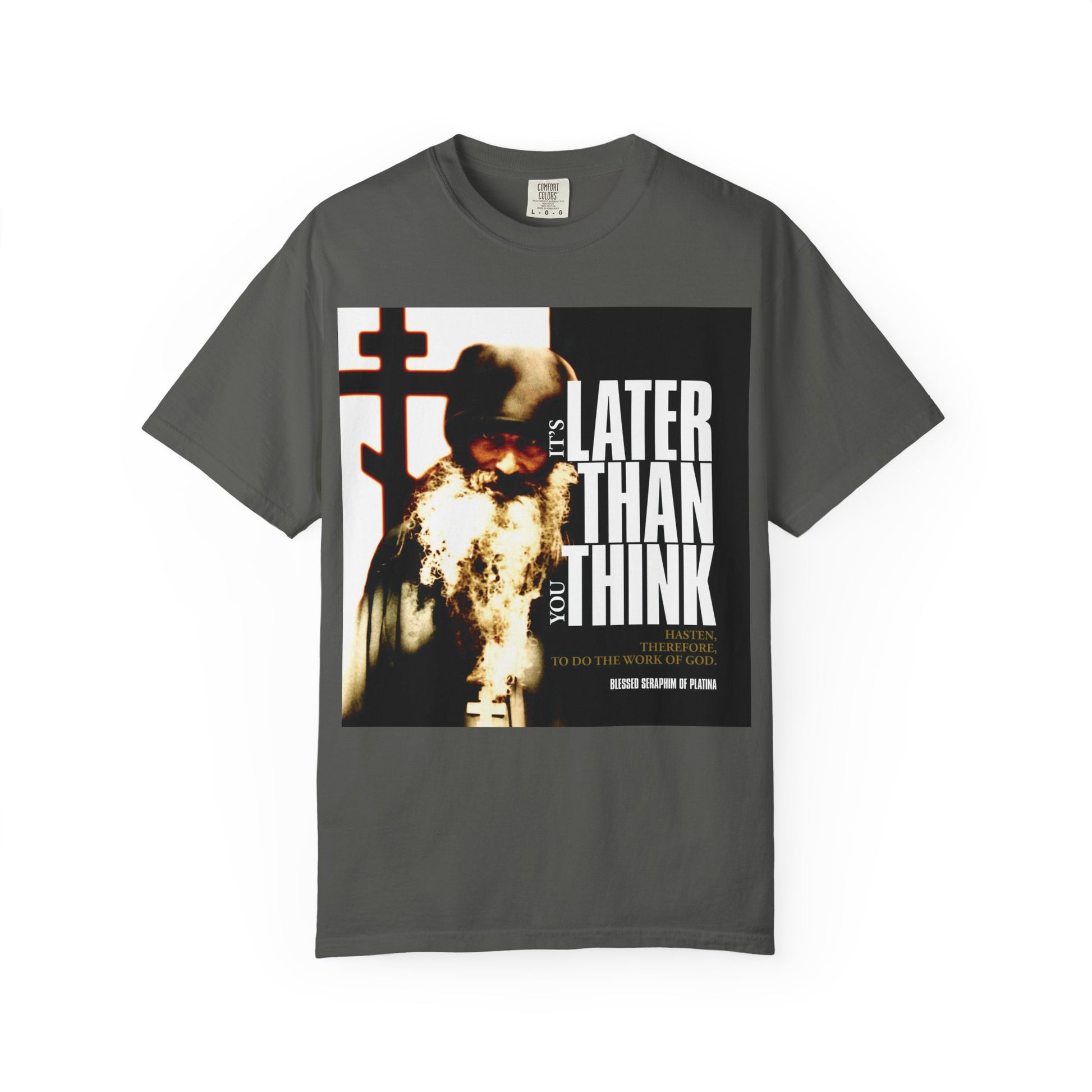 Pepper-colored heavyweight cotton unisex T-shirt featuring a photo of Fr Seraphim Rose and modern cinematic poster typography with the phrase "It's Later Than You Think" on the front.