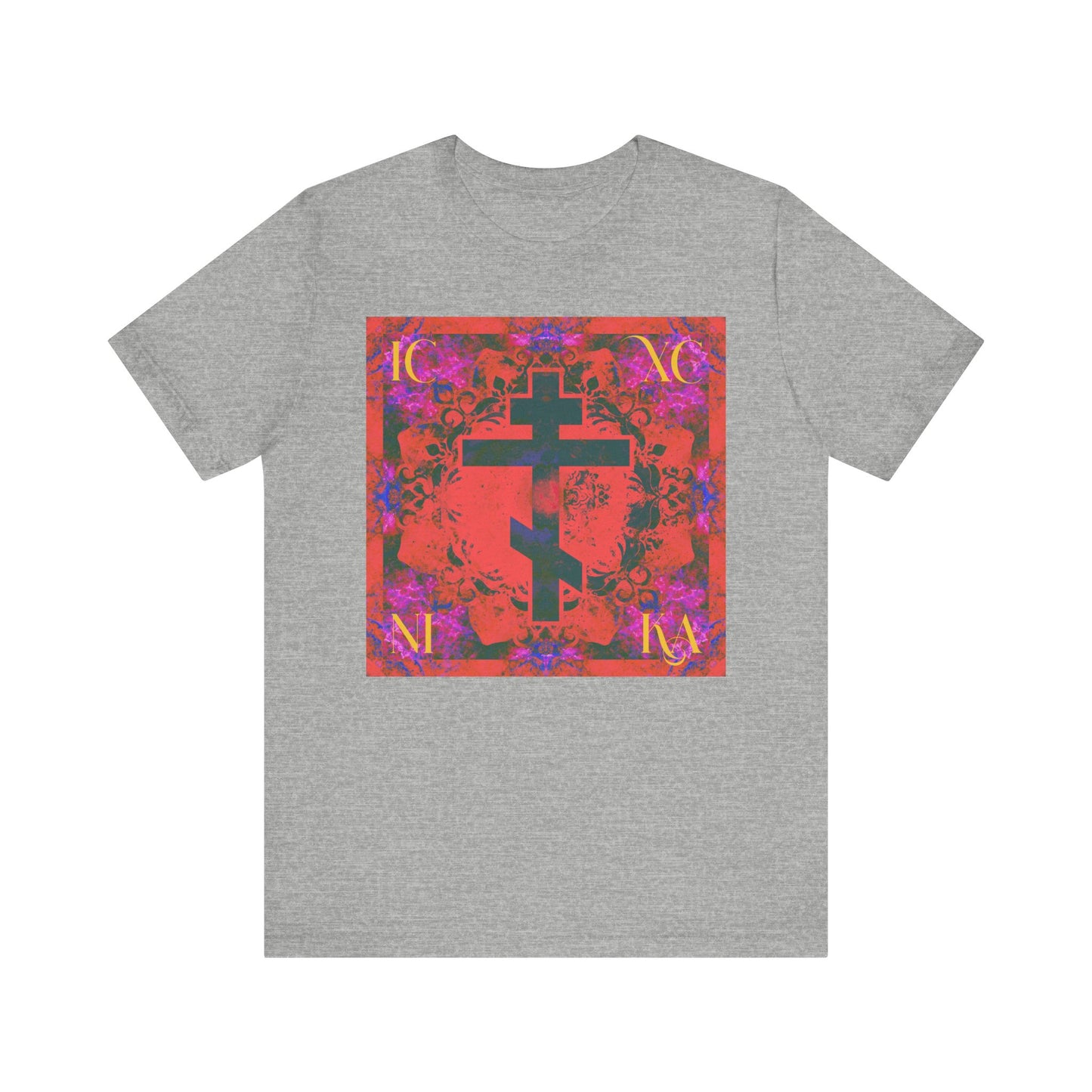 Athletic Heather T-shirt featuring a vibrant orange and magenta Cross design, inspired by Orthodox Christian symbolism, set against a colorful, patterned square background.