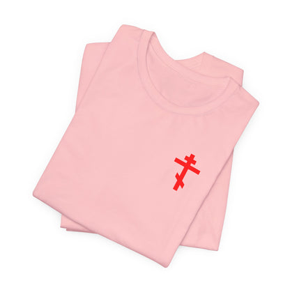 Two folded pink "Idoloclast Idol Smasher Hammer" unisex tees, each featuring a small red cross printed on the front left chest—an understated symbol designed to spark conversation with God and embrace Divine Life in everyday style.