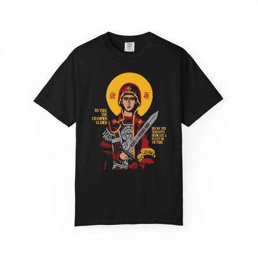 Black "To Thee the Champion Leader" heavyweight cotton t-shirt featuring a Theotokos with Sword iconographic illustration, yellow text, and subtle references to Angels and Divine Incarnation. Unisex Orthodox design.