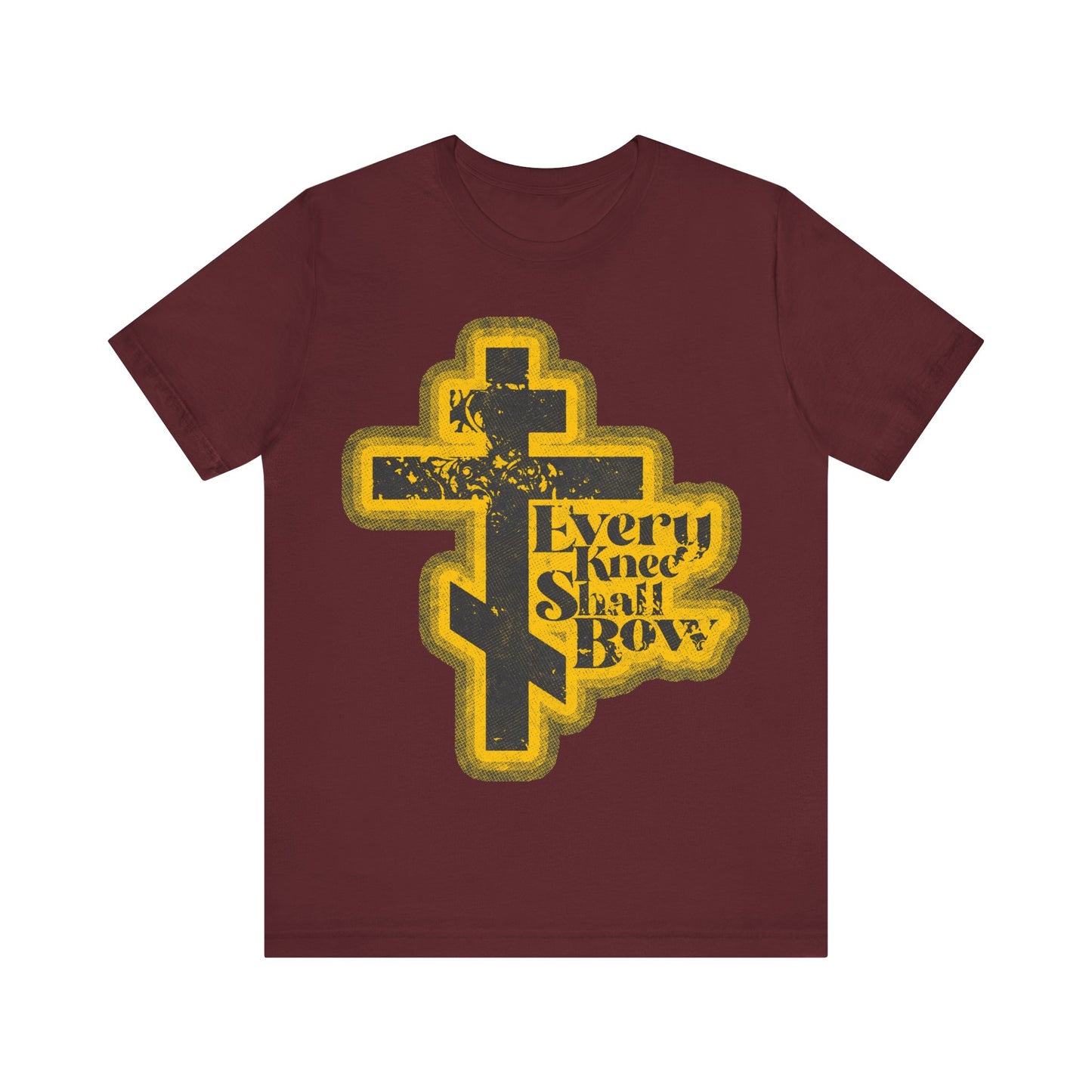 Maroon "Every Knee Shall Bow" t-shirt features a retro halftone comic book design, distressed text, and references Philippians 2:10-11 and Isaiah 45:23. Orthodox Christian apparel.