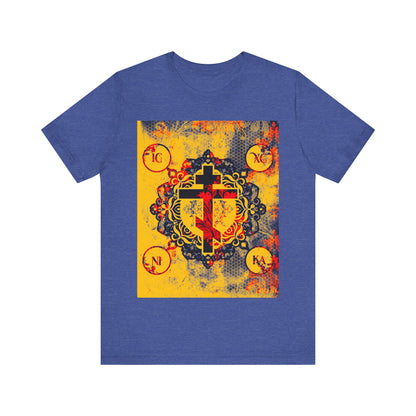 The IC XC NIKA Orthodox Cross T-shirt in Heather True Royal features a yellow and red modern medieval textured floral cross, with circular corner motifs, inspired by the mystery of the Cross and Christ’s sacrifice.