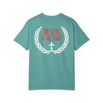 Archangel Michael of the Apocalypse Iconographic / Death is Swallowed Up In Victory DOUBLE-SIDED Heavyweight Cotton Orthodox Unisex Tee—features a teal design with a white laurel, cross, and bold red “DEATH IS SWALLOWED UP IN VICTORY” text on the back, inspired by Revelation 12 and the Miracle of Archangel Michael.