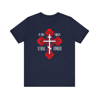 Navy unisex tee with ornate Orthodox Holy Cross and red accents, featuring "In This Sign Ye Shall Conquer" (In Hoc Signo Vinces, ICXC NIKA, Jesus Christ Conquers).