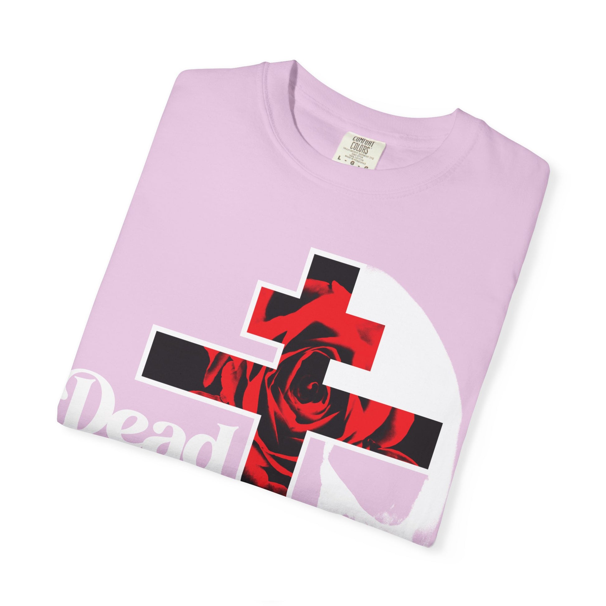 A folded lavender heavyweight cotton t-shirt, featuring the "Dead to this World" bestselling Christian Goth flower cross & skull graphic with 70s typography—an ode to the dispassion in the Ladder of Divine Ascent.