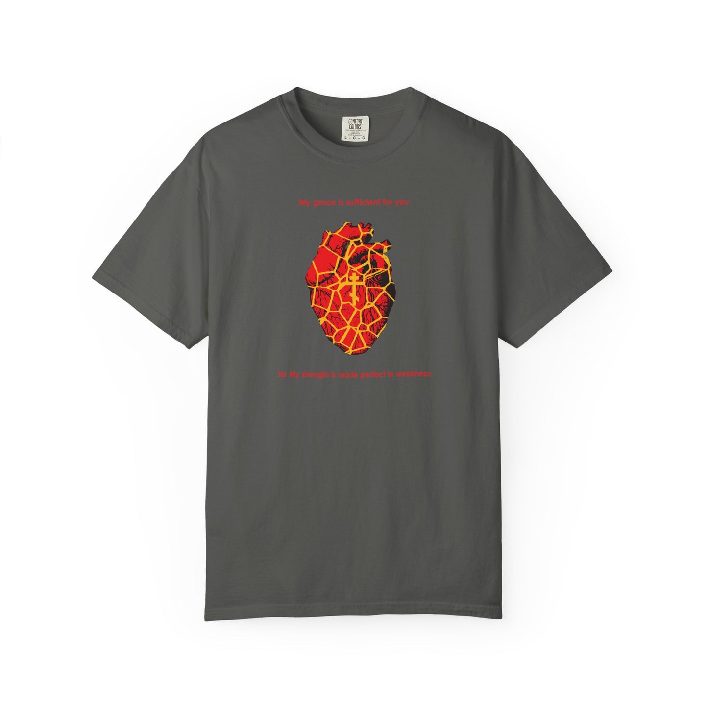 Pepper-colored heavyweight cotton unisex tee featuring a Kintsugi-style golden broken heart with an Orthodox cross, red and yellow anatomical details, and text above and below inspired by 2 Corinthians 12:9—celebrating the beauty, grace, and strength found in a once broken spirit. Product name: My Strength is Made Perfect in Weakness (2 Cor 12:9) | Kintsugi Style Golden Broken Heart | Orthodox Cross.