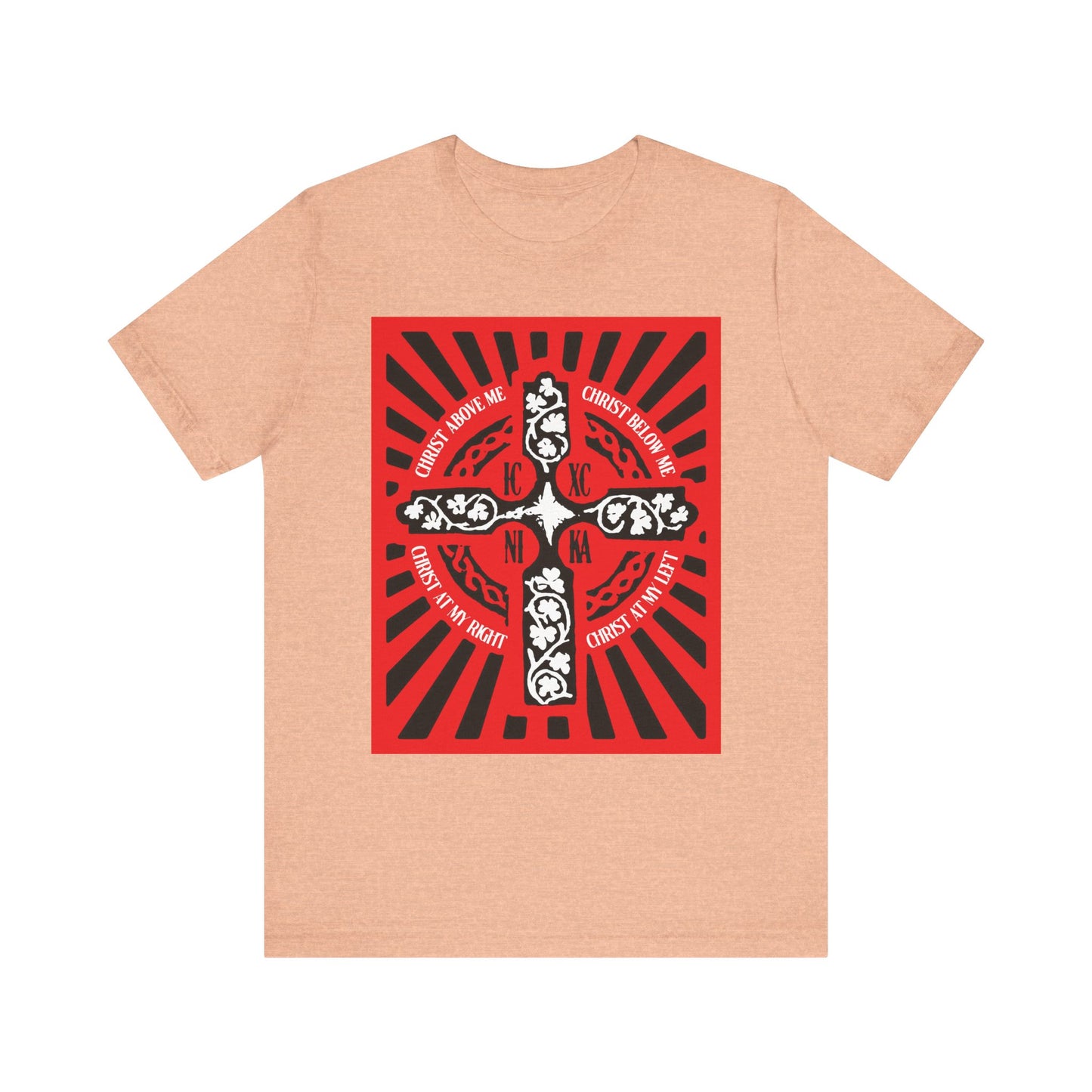 Heather peach unisex lightweight cotton tee featuring a red ICXC NIKA Enniskillen Celtic Cross with an ornate design and religious shield prayer text inspired by the Lorica of St. Patrick.