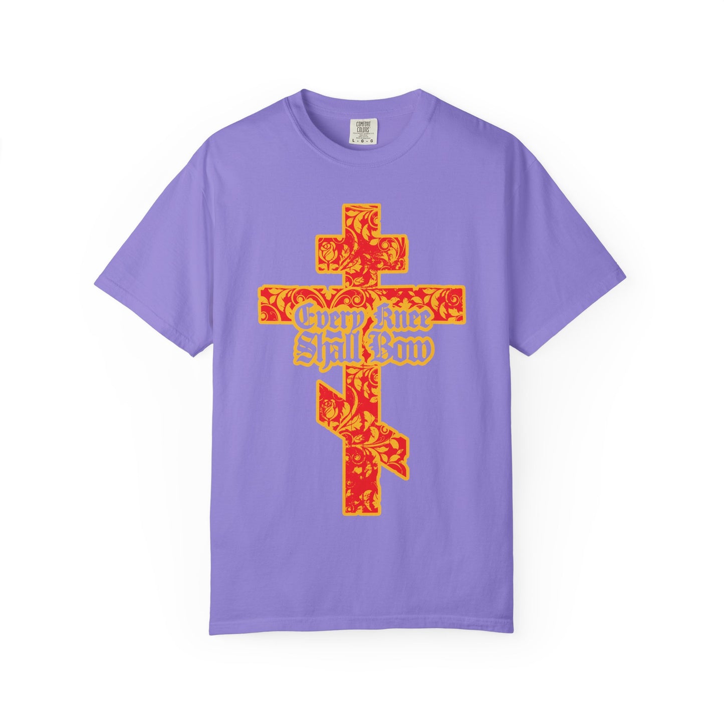 Violet heavyweight cotton unisex tee featuring a gold and red floral-textured Orthodox cross with gothic letters reading “Every Knee Shall Bow” on the front, inspired by Isaiah 45:22-24 and Philippians 2:7-11.