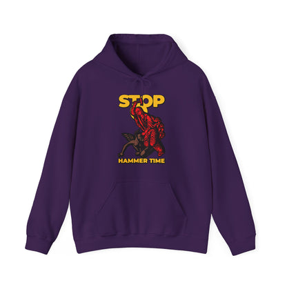 Red, blue, and yellow "St Marina of Antioch Beating the Devil with a Hammer" hoodie featuring "Stop, Hammer Time"—a modern Orthodox meme design perfect for fans of bold Christian figures and unique religious apparel.
