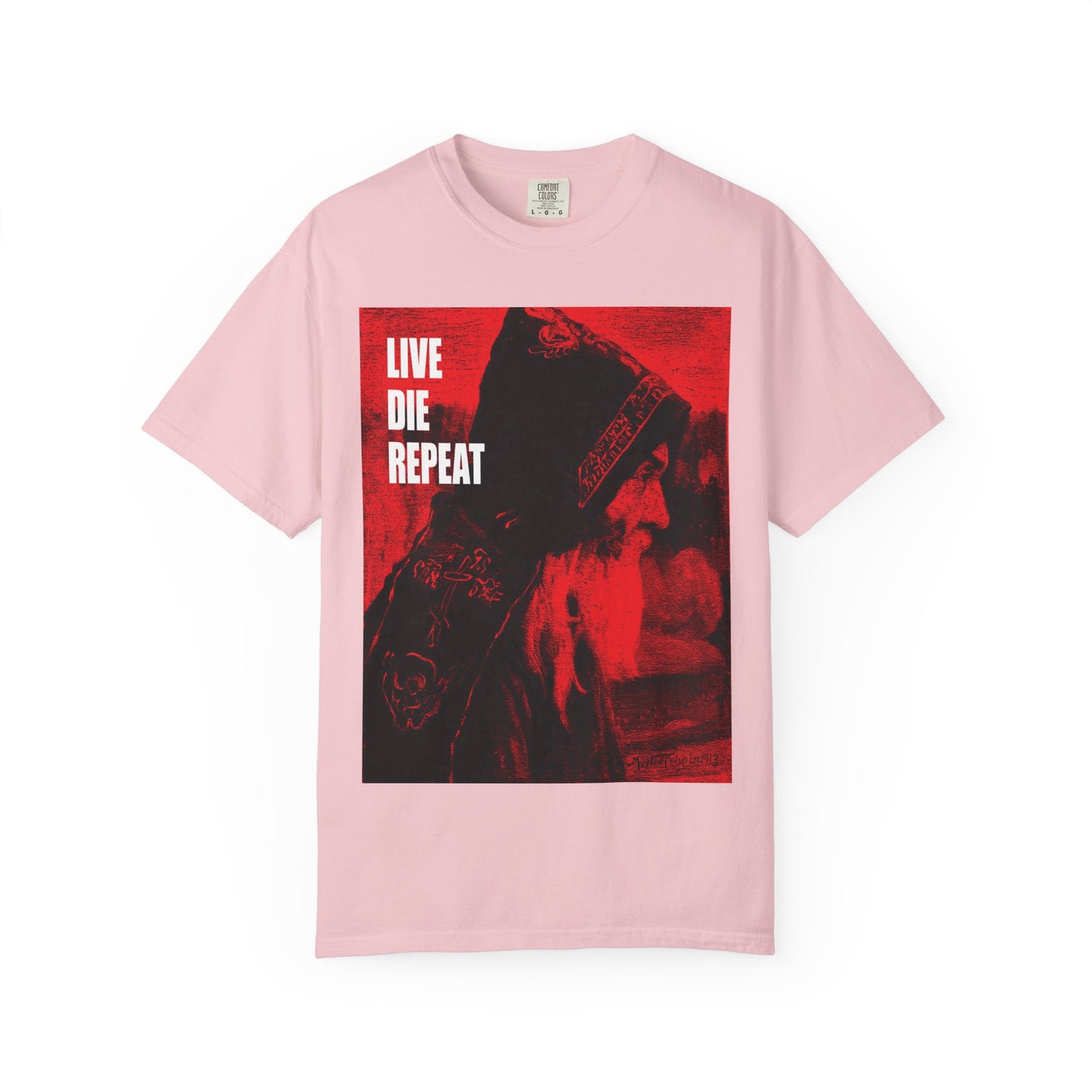 Blossom-colored heavyweight cotton tee featuring Mikhail Nesterov’s Orthodox monk art with bold "LIVE DIE REPEAT" text—an ascetic message: Die every day, you will live forever in spirit.