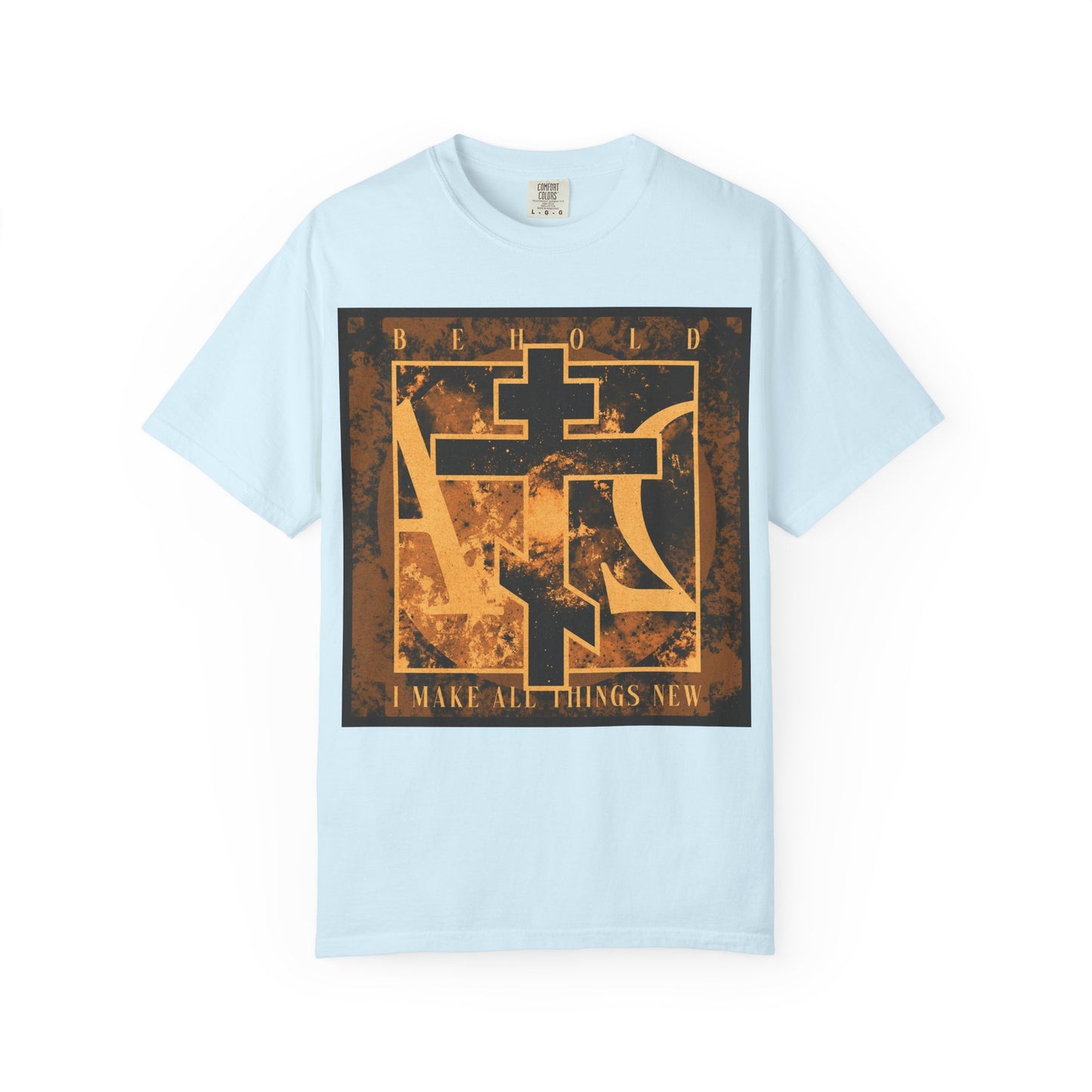 Chambray heavyweight cotton unisex T-shirt featuring a brown and orange Orthodox cross with Alpha & Omega background and the text: BEHOLD, I MAKE ALL THINGS NEW—a powerful reference to Revelation 21:5 and the promise of renewal.