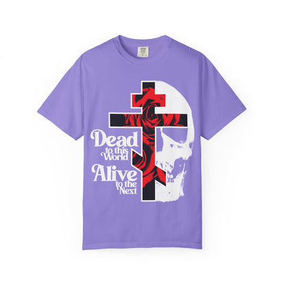 The “Dead to this World” violet t-shirt features a gothic cross, red roses, skull art, and 70s typography—a bestselling heavyweight cotton unisex design inspired by The Ladder of Divine Ascent’s Renunciation of the World.