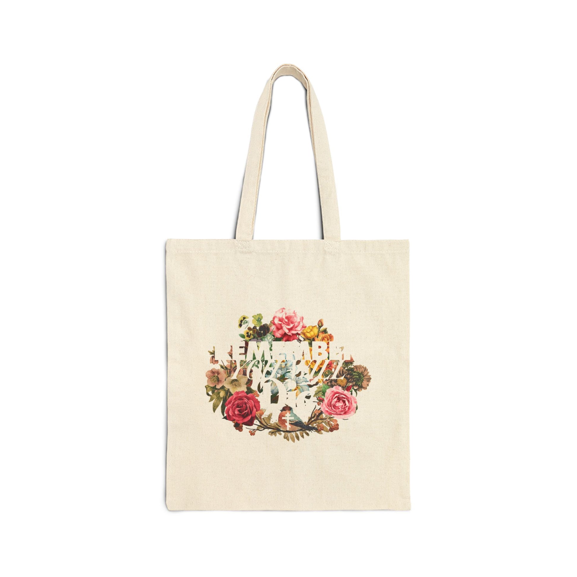 Natural tote bag featuring "Remember You Will Die" in classic typography with a cross and floral wreath design, inspired by Orthodox Christian memento mori teachings. Displayed on a white background.