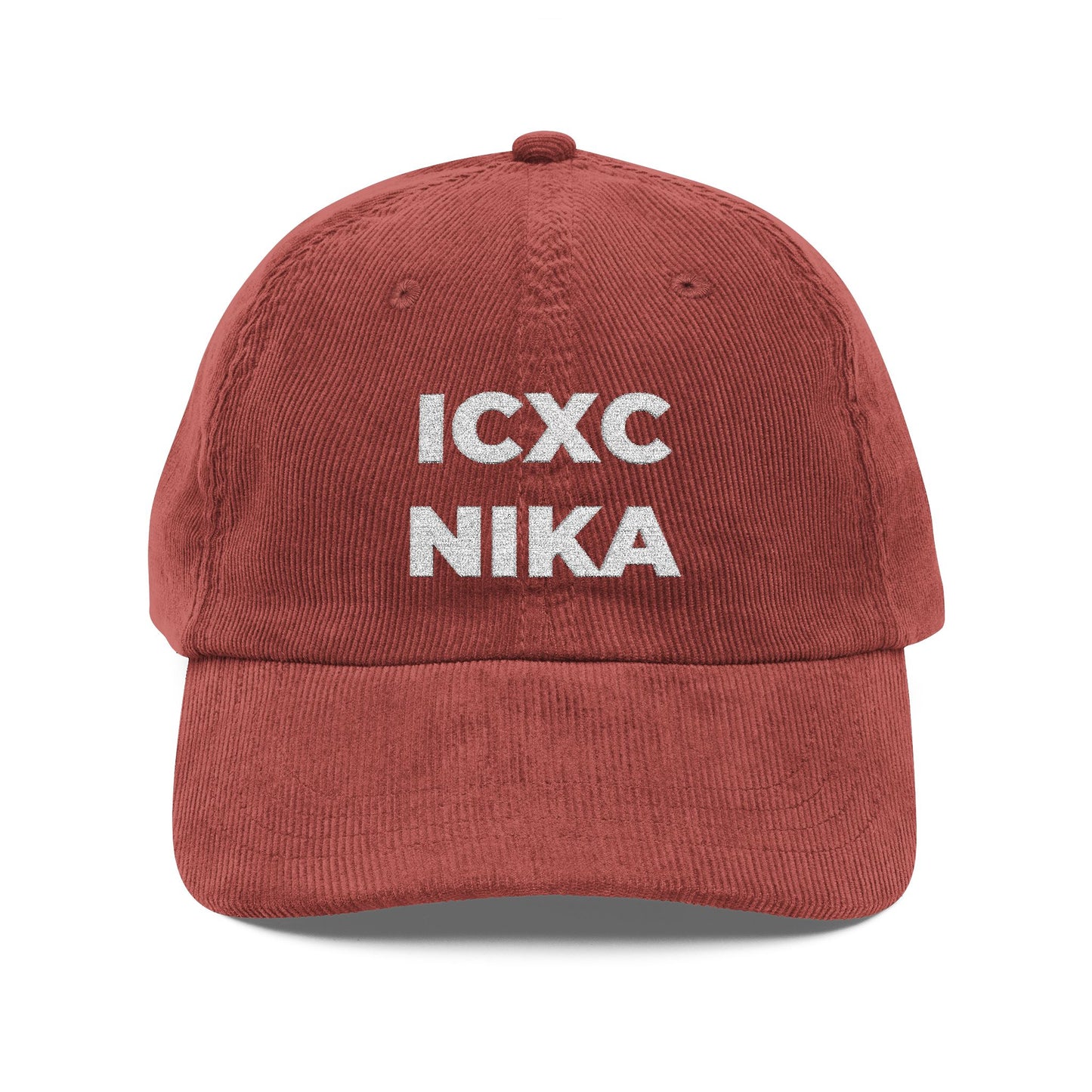 A burgundy cotton corduroy cap featuring the white embroidered ICXC NIKA Christogram, meaning "Jesus Christ Conquers," symbolizing Orthodox Christian faith.