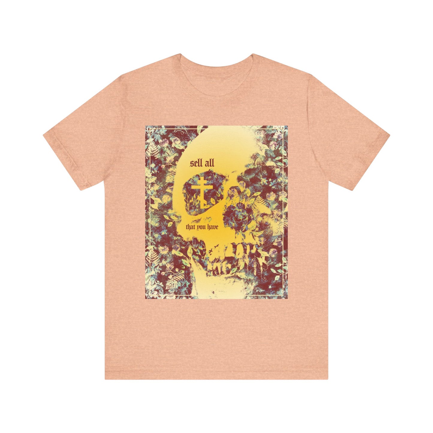 Heather peach unisex tee featuring a yellow floral skull and Orthodox cross graphic with the phrase "Sell All That You Have" on the front—an ascetic, Christian design inspired by the call to keep the commandments and seek the kingdom of heaven.