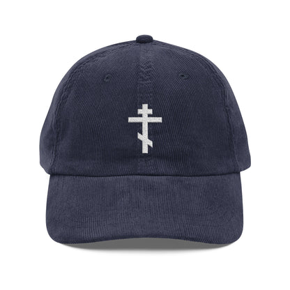 Navy blue cotton corduroy cap with a white embroidered Orthodox TriBar Cross, the weapon of unseen warfare that makes demons tremble—an Orthodox Christian symbol of faith and salvation.