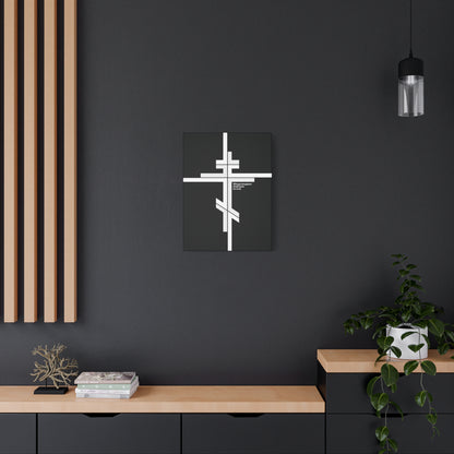 A modern room with a black wall, wooden shelves, books on Orthodox doctrine, a plant, and the "Whose Kingdom Shall Have No End" Luke 1:32-33 Orthodox Cross minimalist Christian canvas art—radiating serene faith.