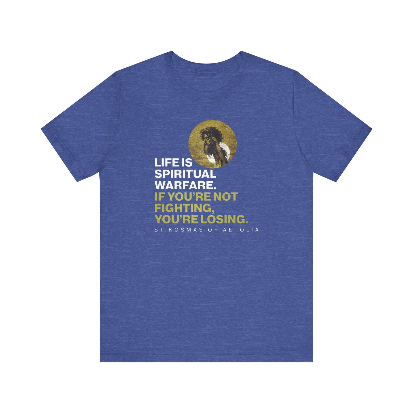 Heather True Royal unisex tee featuring St Kosmas of Aetolia and “Life is spiritual warfare. If you’re not fighting, you’re losing”—inspired by David & Goliath, Unseen Warfare, and Orthodox faith. Lightweight cotton for comfort.