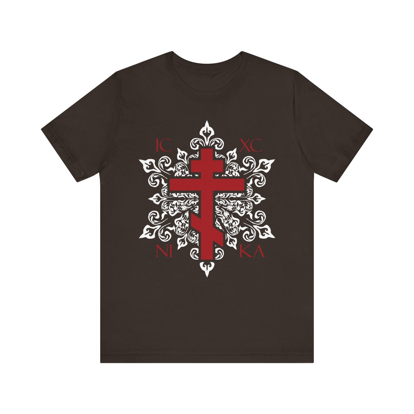 Brown unisex cotton T-shirt featuring the ICXC / NIKA red Orthodox cross on an ornate white medieval floral design. This best-selling Orthodox Christian tee blends tradition with modern style.