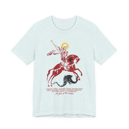 Heather ice blue t-shirt featuring an iconographic image of St George slaying the dragon, with a quote inspired by St John Climacus in red and black text beneath the graphic, reflecting on mourning over one’s sins according to God.