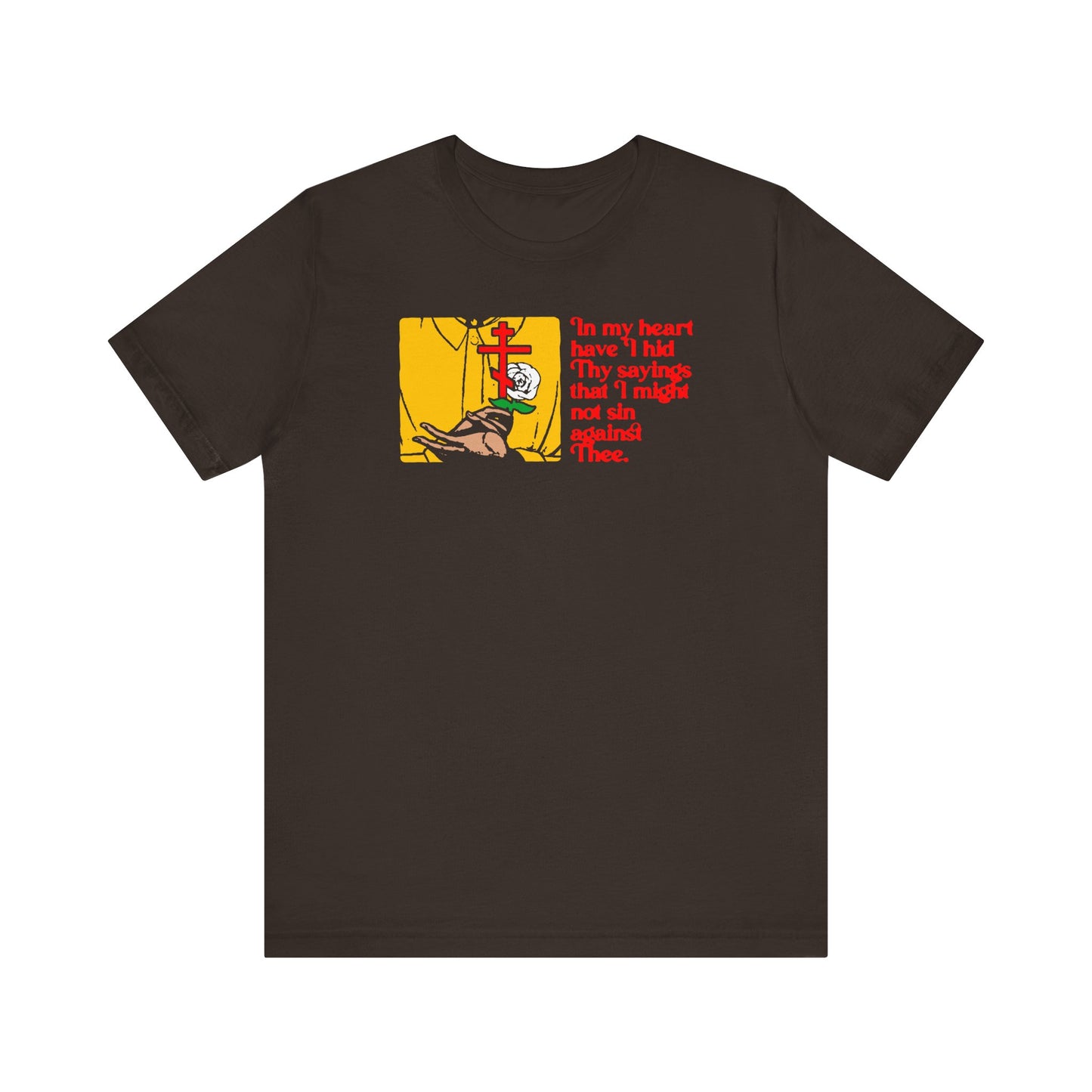 Brown t-shirt featuring a graphic of a person kneeling by a cross and red text with the religious quote "In My Heart Have I Hid Thy Sayings (Psalm 117/118)" from the Orthodox Christian tradition.