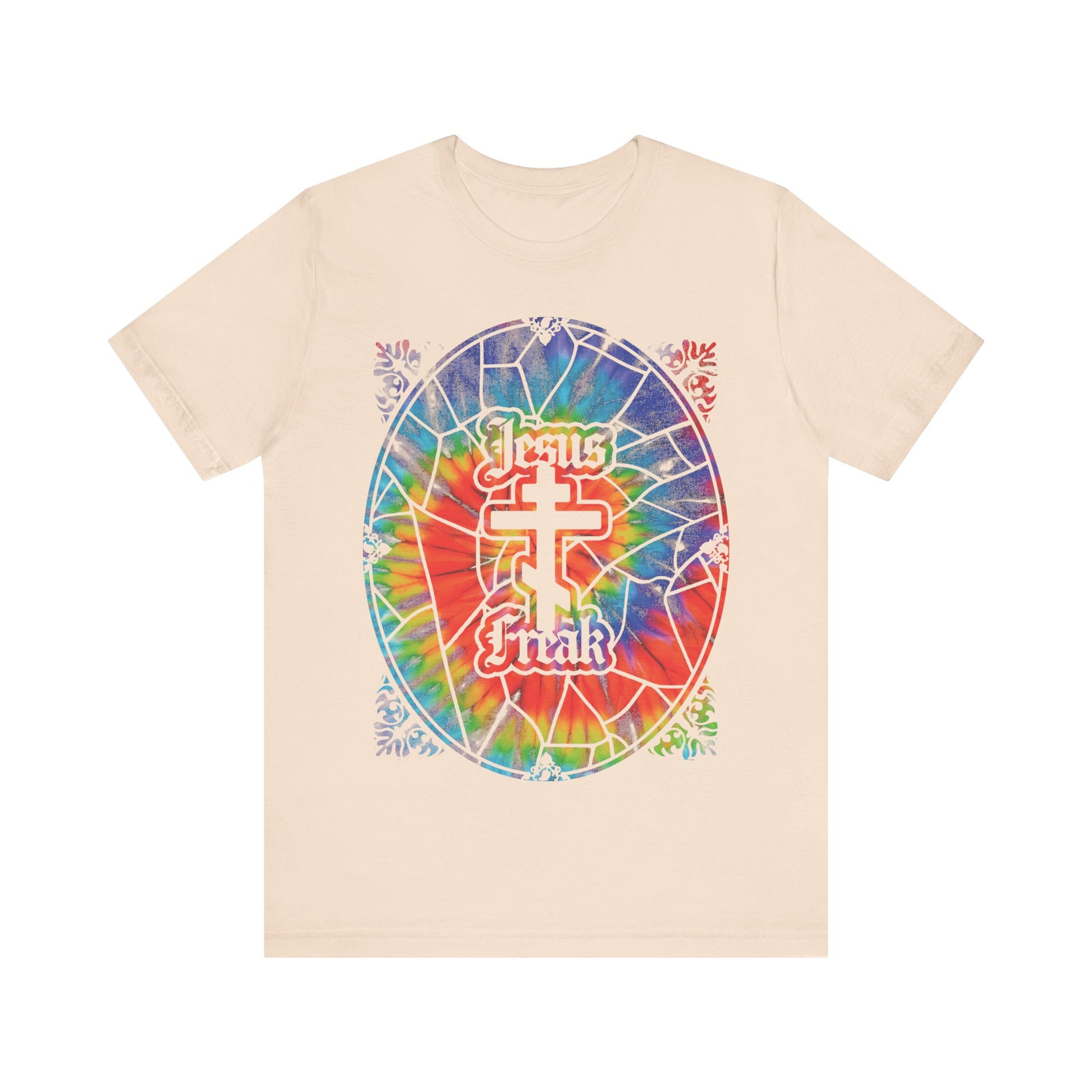 Beige unisex tee featuring a tie-dyed stained glass window, Orthodox cross, and “Jesus Freak” text—celebrating 70s Jesus Movement hippie style.