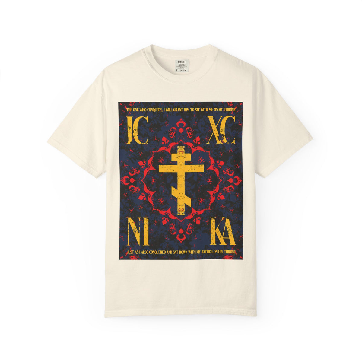 Ivory heavyweight cotton unisex t-shirt featuring an ornate IC XC NIKA Orthodox cross in a medieval floral design, adorned with Cyrillic letters in red, yellow, and black on the front—a bold statement inspired by “The One Who Conquers” (Revelation 3:21), inviting reflection on salvation through the grace of God.