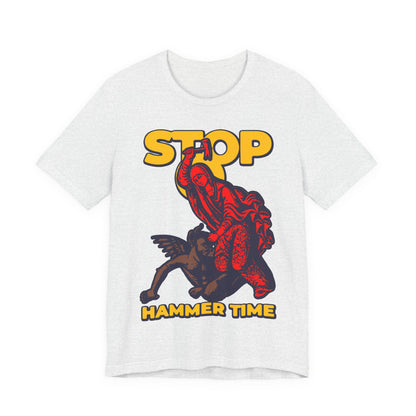 White tee featuring St Marina of Antioch beating the devil with a hammer, plus "STOP, HAMMER TIME" in yellow—a modern Orthodox meme in red, blue, and yellow for Christian unisex style.