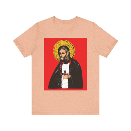 Heather peach unisex cotton tee featuring St. Seraphim of Sarov with the text "True Aim of Christian Life is Acquisition of the Holy Spirit" in an Orthodox iconographic style. 2-sided lightweight design.