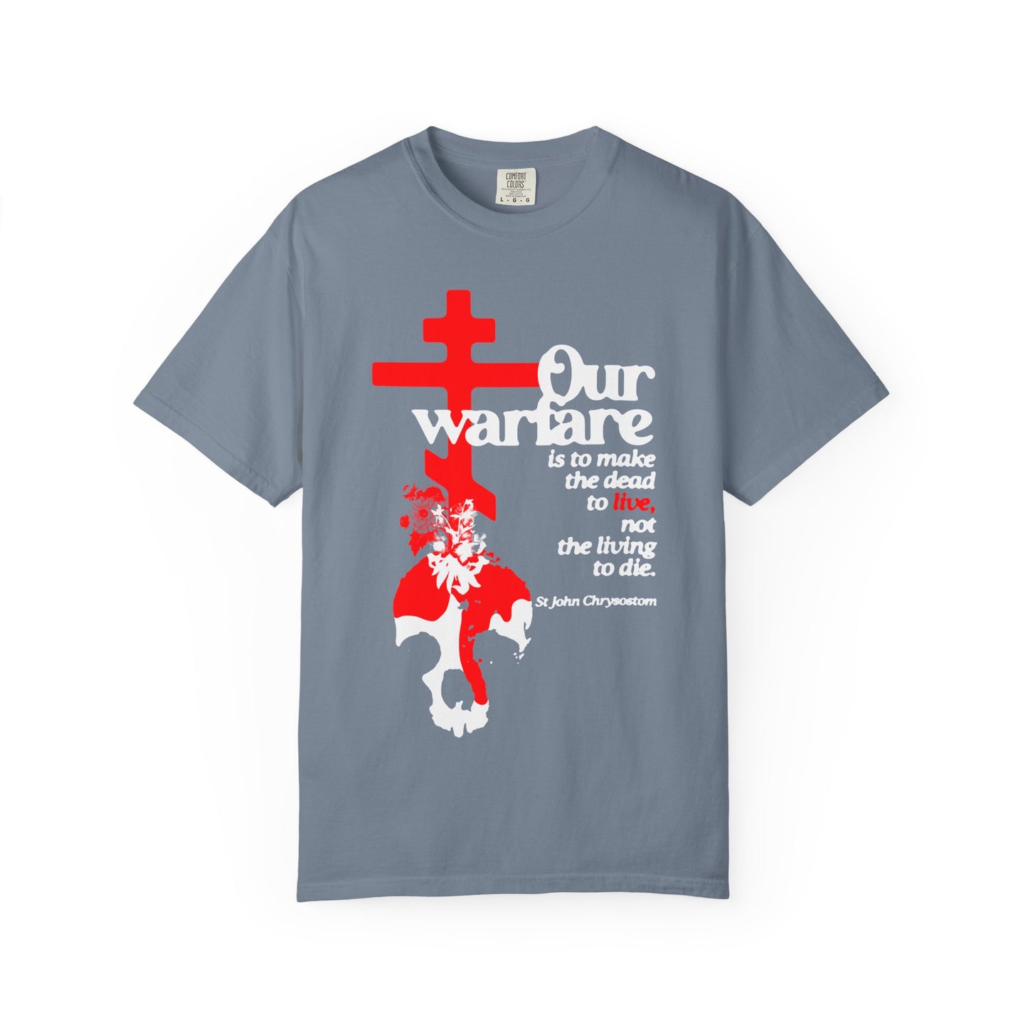 Blue Jean heavyweight cotton unisex tee featuring an Orthodox cross, flowers, and skull, with the quote: “Our warfare is to make the dead to live, not the living die”—a powerful reflection of true Christian strength as taught by St. John Chrysostom.