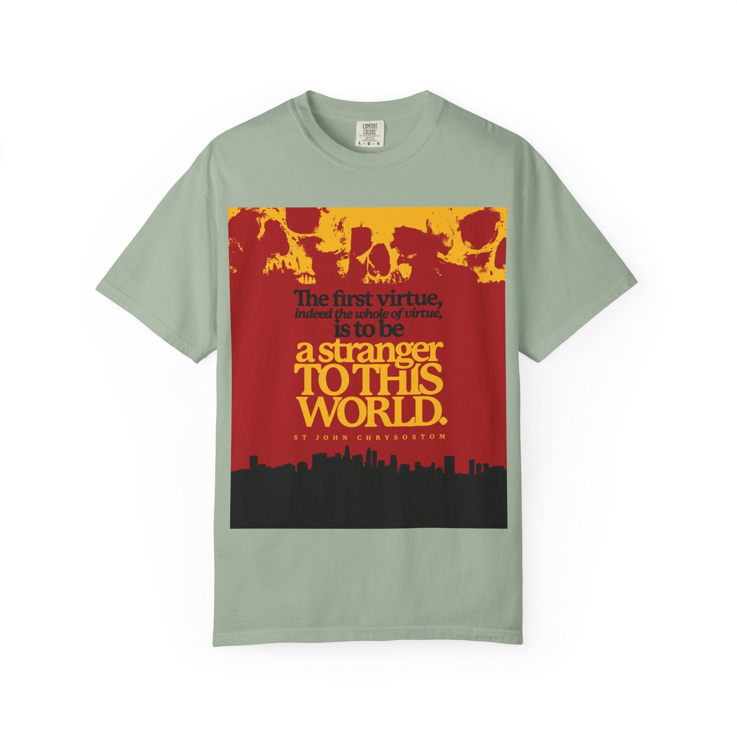 Bay-colored heavyweight cotton unisex t-shirt featuring “Be a Stranger to this World” by St John Chrysostom, with Skulls & Cityscape graphic. Inspired by Hebrews 11:13-16 and the Orthodox Christian theme of being strangers on earth.