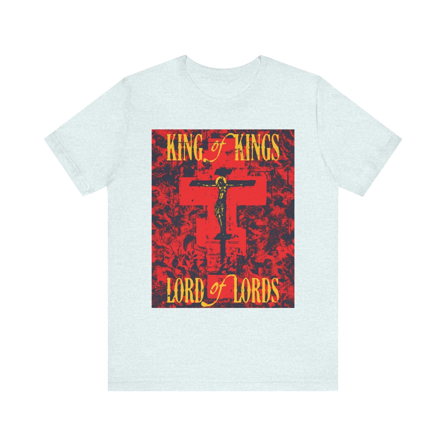 Heather Ice Blue T-shirt featuring a yellow and red Orthodox iconographic design with the words "King of Kings, Lord of Lords" and a crucifix, celebrating Christ crucified as described in the Word of God; made from lightweight cotton with a nature-inspired texture—unisex fit.
