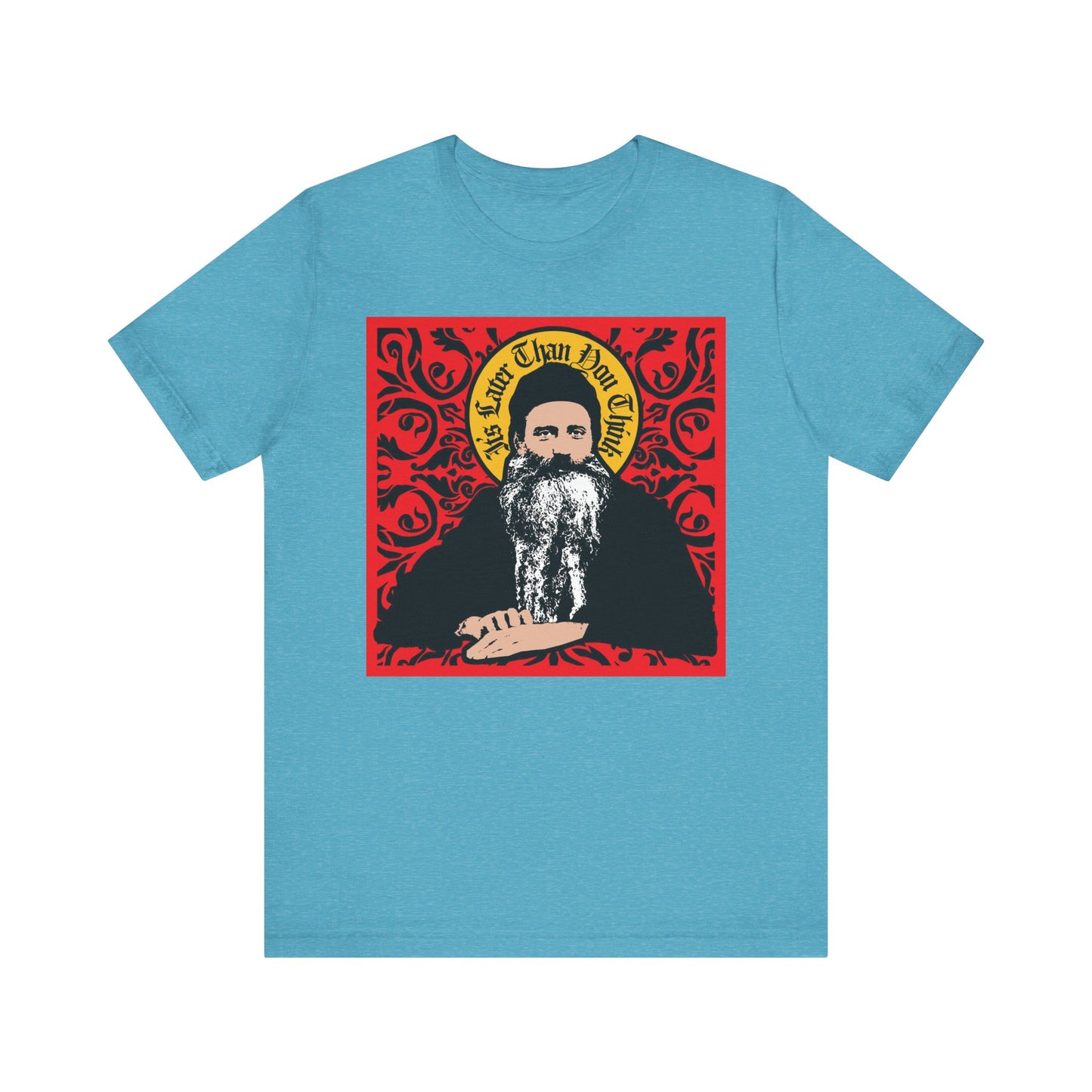 Heather Aqua unisex tee featuring Saint Seraphim Rose in icono-graphic style, red ornate design, and "It's Later Than You Think" text; lightweight cotton.