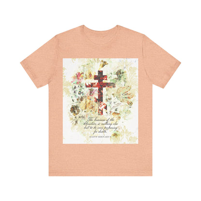 Heather Peach t-shirt featuring a white and beige floral scrapbook texture cross with an arts & crafts style, St. Irenaeus quote, and Orthodox Christian inspiration on the front.
