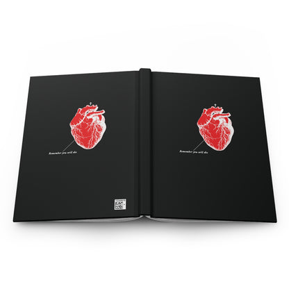 The black hardcover journal features red anatomical heart illustrations and the phrase Sometime you will die on both covers, with lined pages ideal for reflections or quotes from Holy Fathers. The design is inspired by retro medical textbooks and includes inverted shadows.