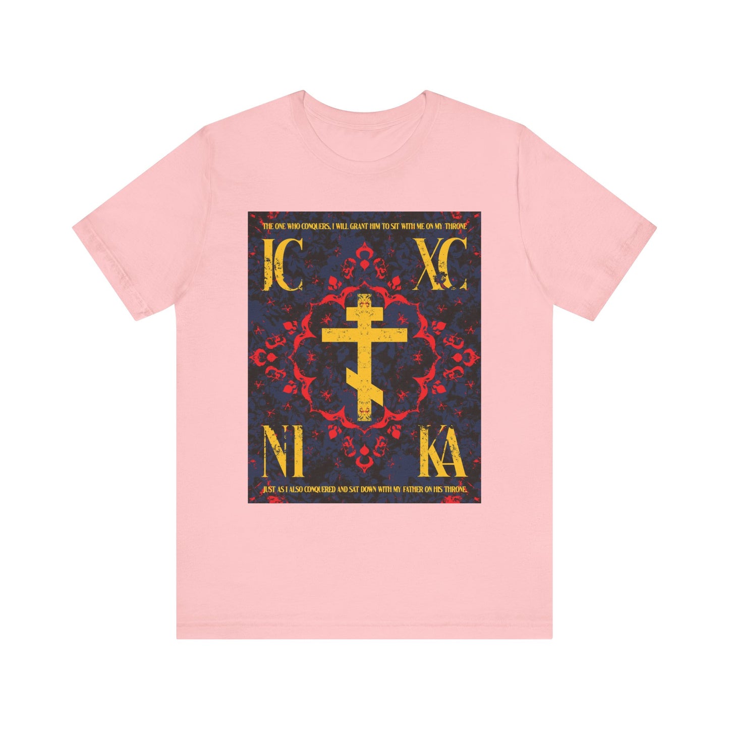 Pink IC XC NIKA Orthodox Cross t-shirt featuring a medieval floral design and "The One Who Conquers" (Revelation 3:21) in gold letters—a lightweight cotton unisex tee symbolizing faith and grace.