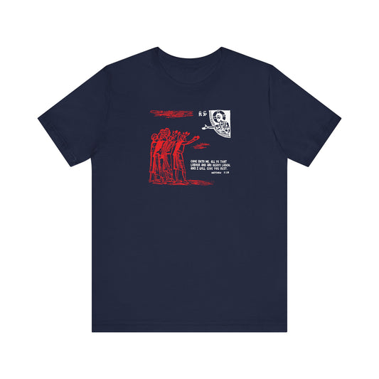 Navy unisex tee featuring a red graphic face inspired by St. Cyril of Alexandria, people sketch, and white "Come Unto Me All Ye That Labour & Are Heavy Laden (Matt. 11:28)" text on the chest. Orthodox lightweight cotton.