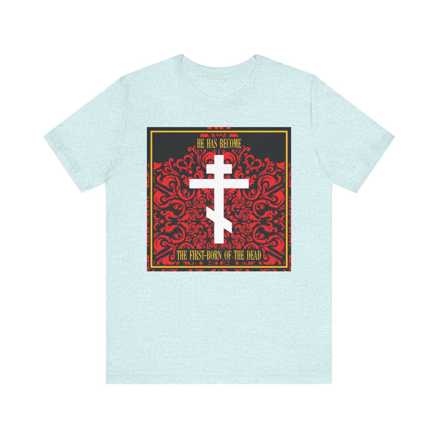 Heather Prism Ice Blue unisex tee with a white Orthodox cross on red floral texture and the words “He has become the firstborn of the dead,” honoring Jesus Christ as our faithful witness. Lightweight cotton for comfort.